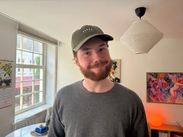 Joris smiling in a Paros cap